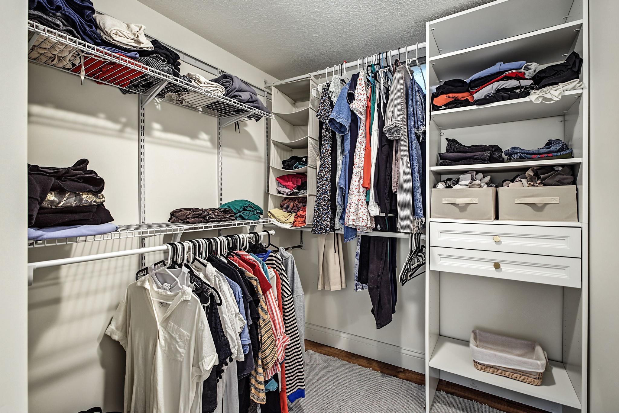 Walk-in closet in primary bedroom