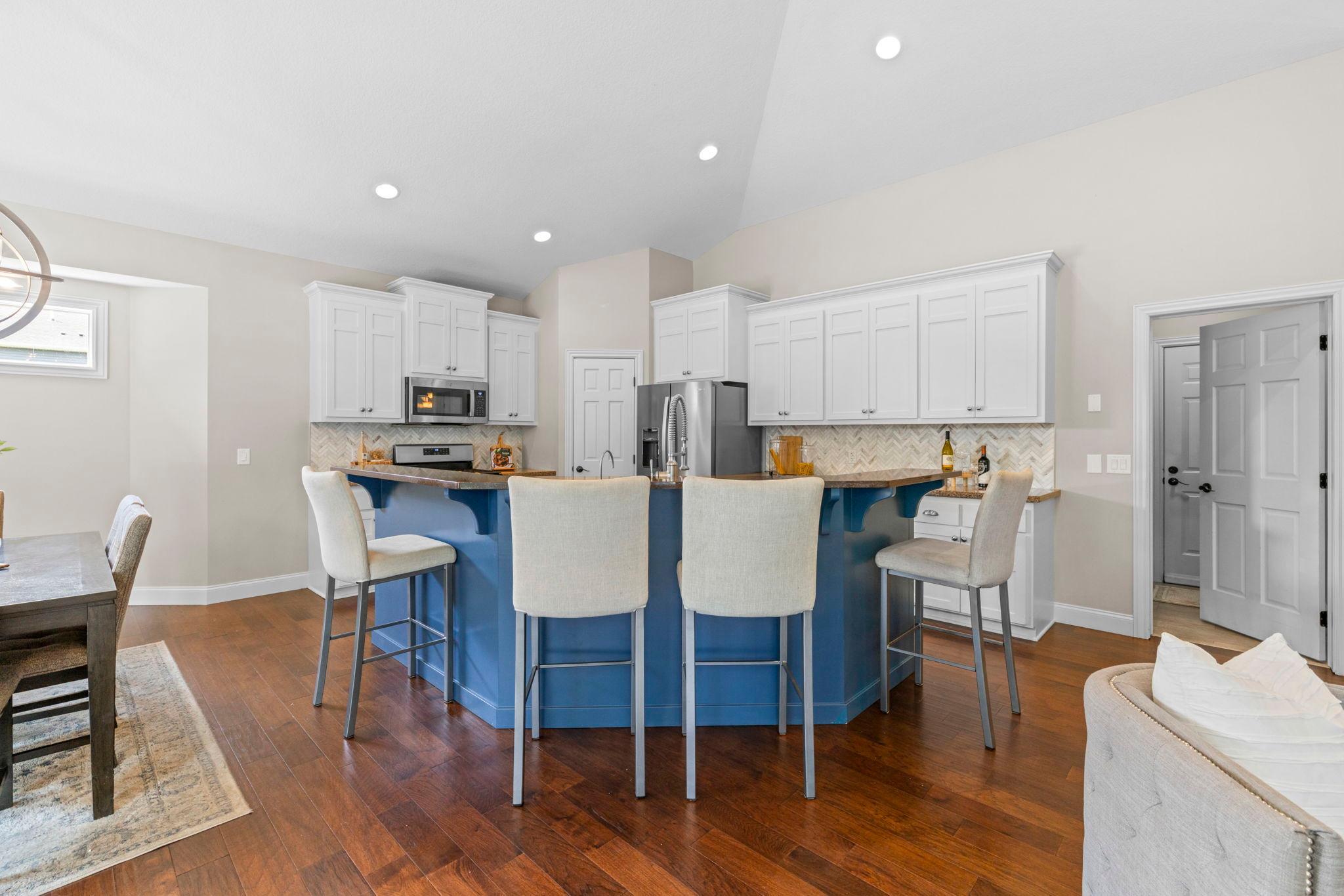 Open flow from the living room into the kitchen and dining area.