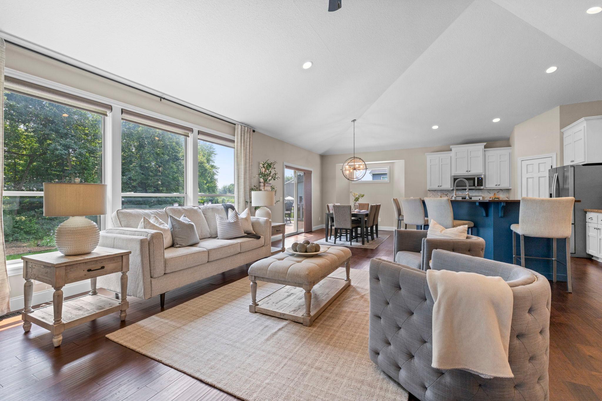 Large picture windows overlooking the backyard.