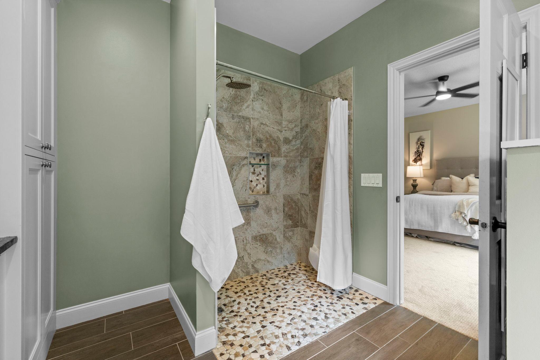 Beautiful tile shower in the Primary bathroom.