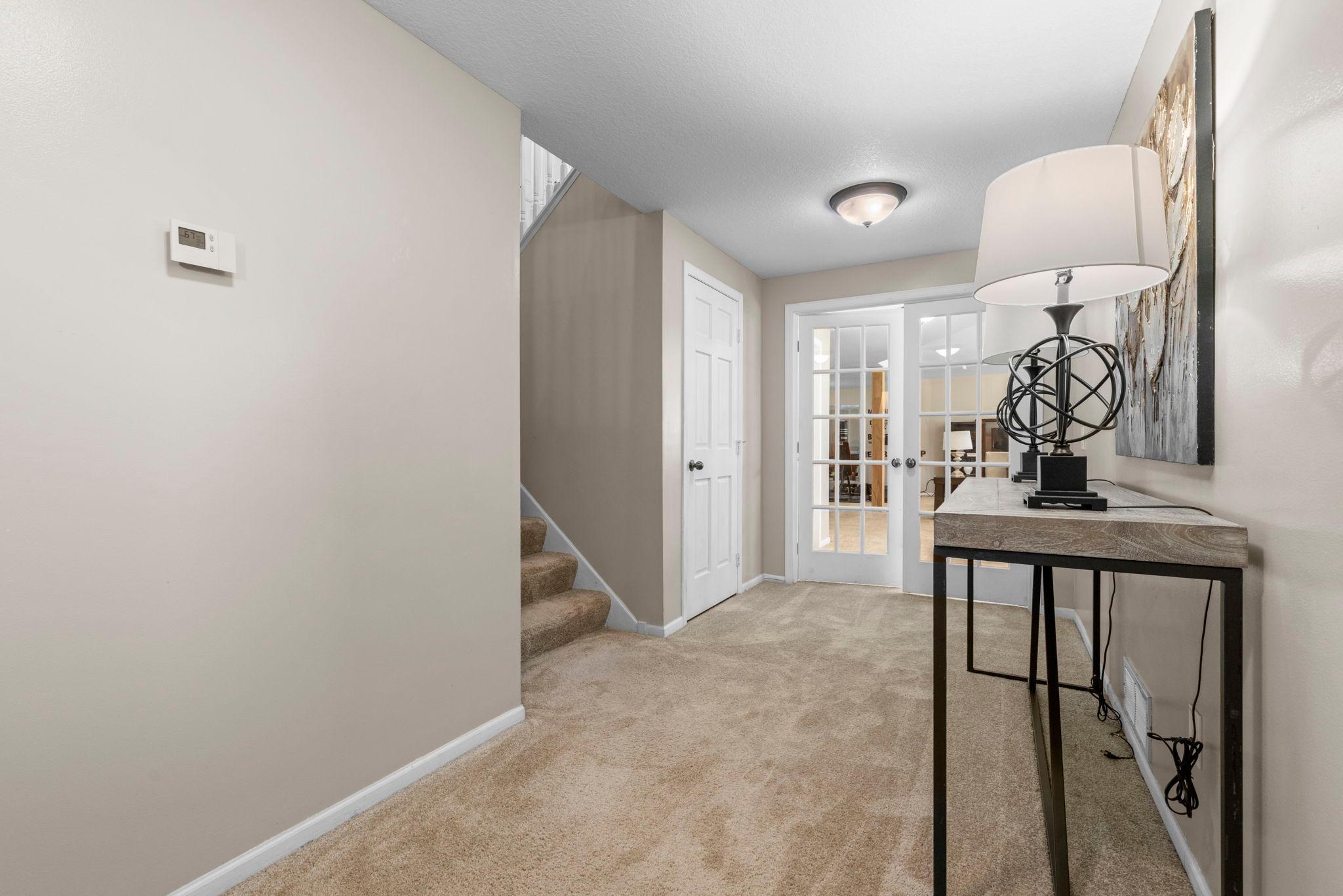 Beautiful french doors leading you to the lower lever family room.
