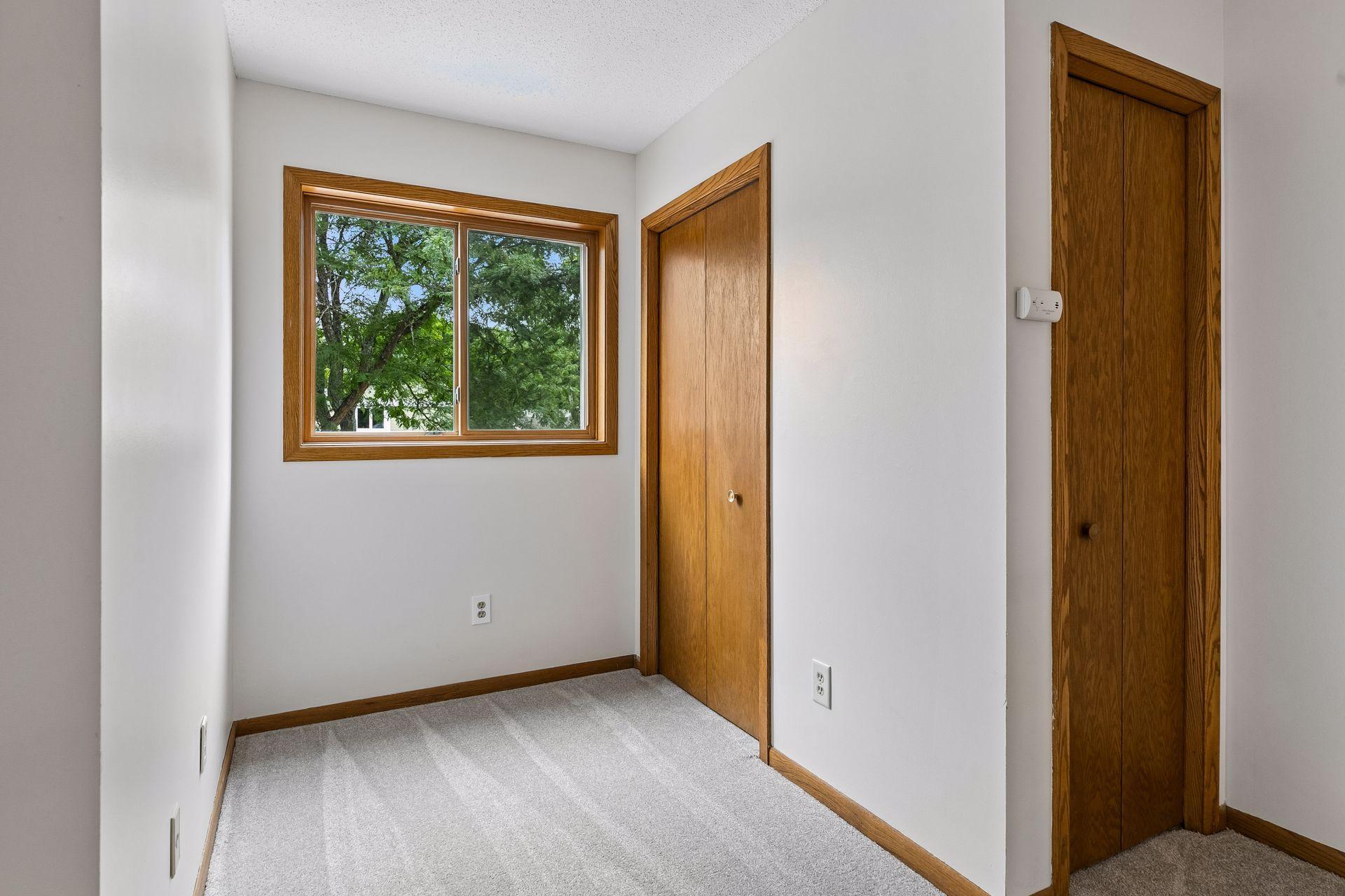 Upper-level flex nook with two closets, offering great additional storage and space for a small desk or workstation