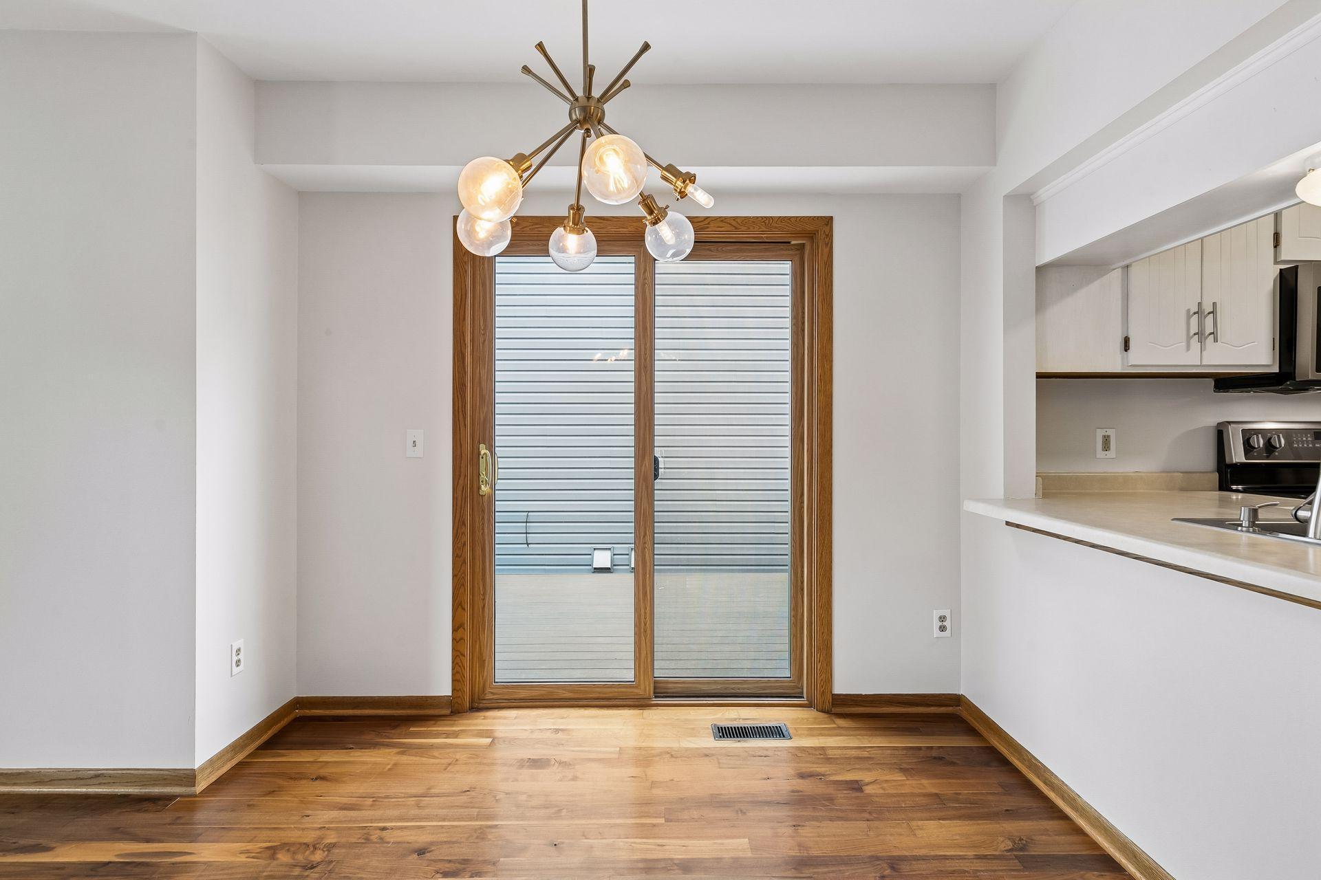 Sliding glass door leads out to the maintenance free deck- which offers a perfect space for outdoor dining, entertaining and relaxation.