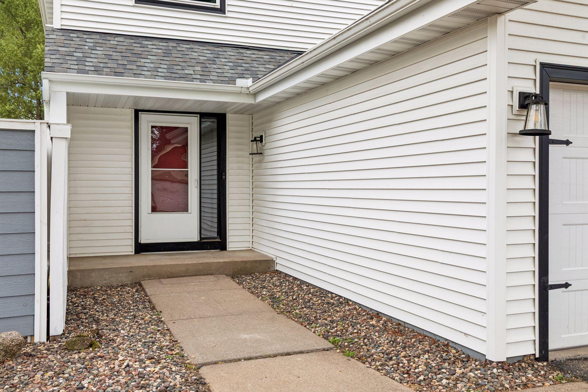 Private front entrance with room for plants or a chair.