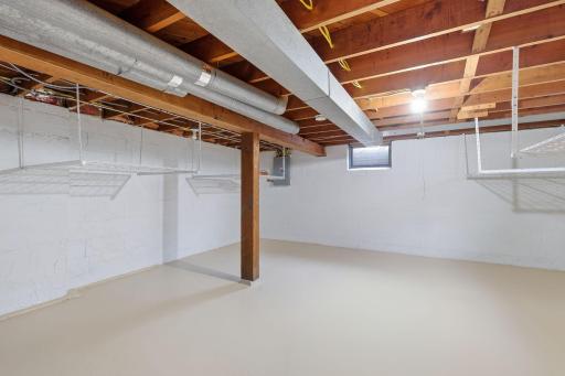 Lower level unfinished basement area - lots of potential for workshop or recreation area
