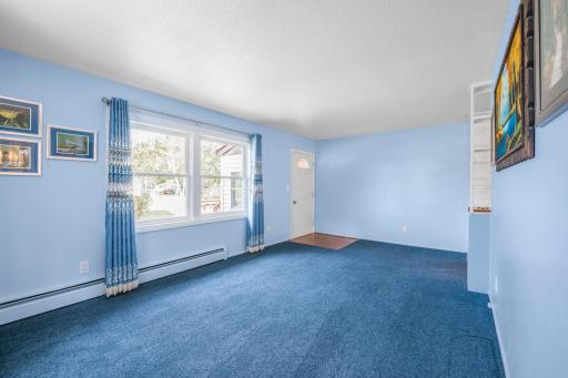 Another view shows the generous size of the living room and convenient front entry.
