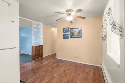 Another view of the dining area highlights the open connection to the living room and convenient main-level layout.