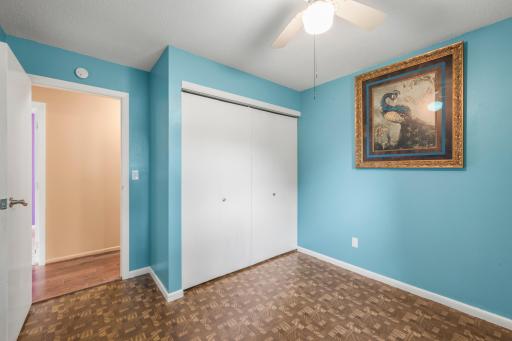 Additional view of the third bedroom showing its closet and proximity to the other main-level rooms.
