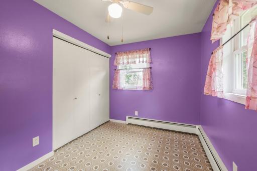 The second view highlights the bedroom closet and natural light from windows on two sides.
