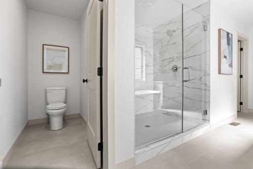 Private stool space, glass enclosed tile shower