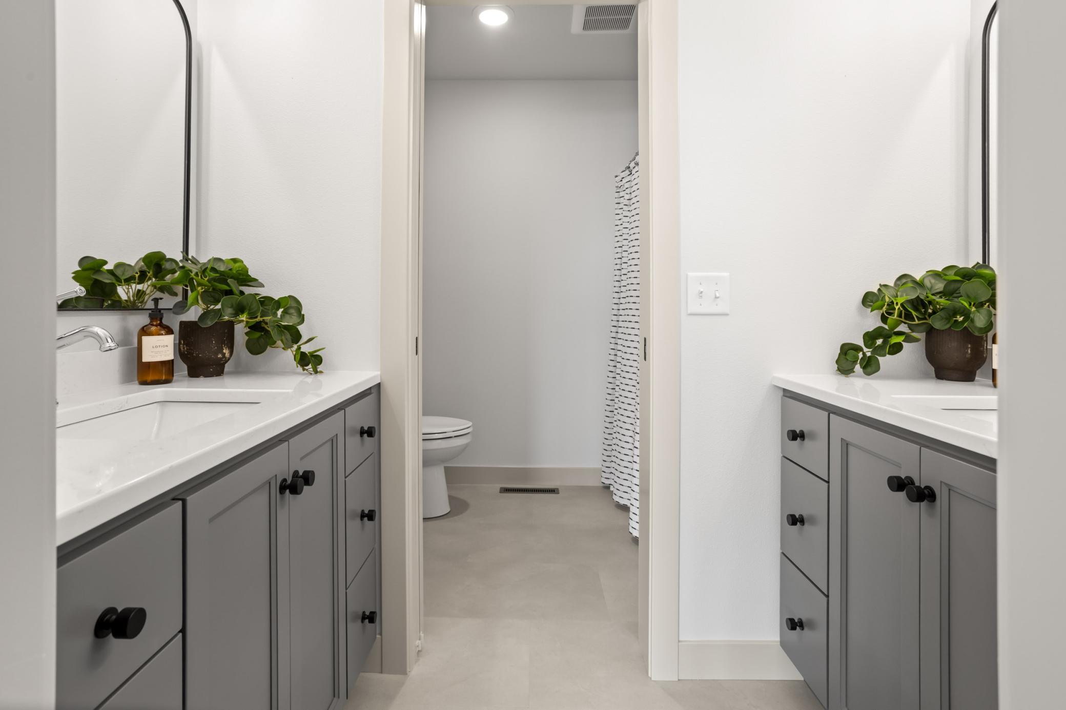 Guest Bathroom: double vanities, private stool/ shower space
