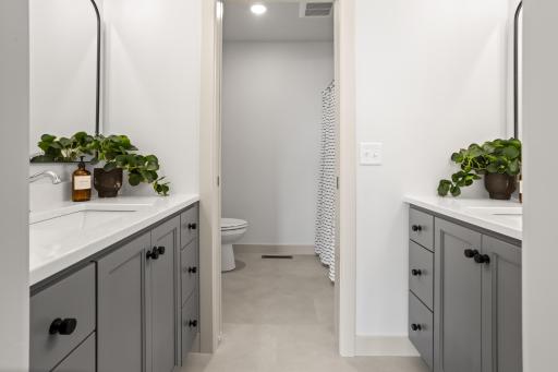 Guest Bathroom: double vanities, private stool/ shower space