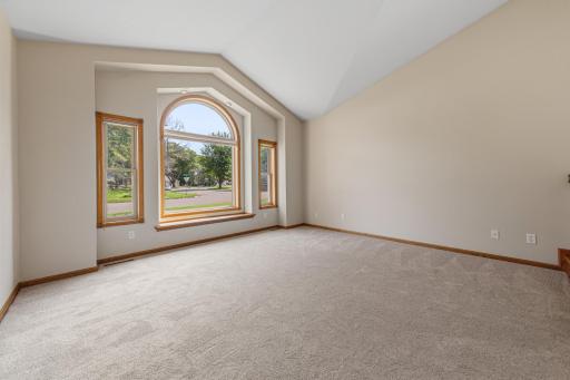 Large living room with new carpet and built-in window seat