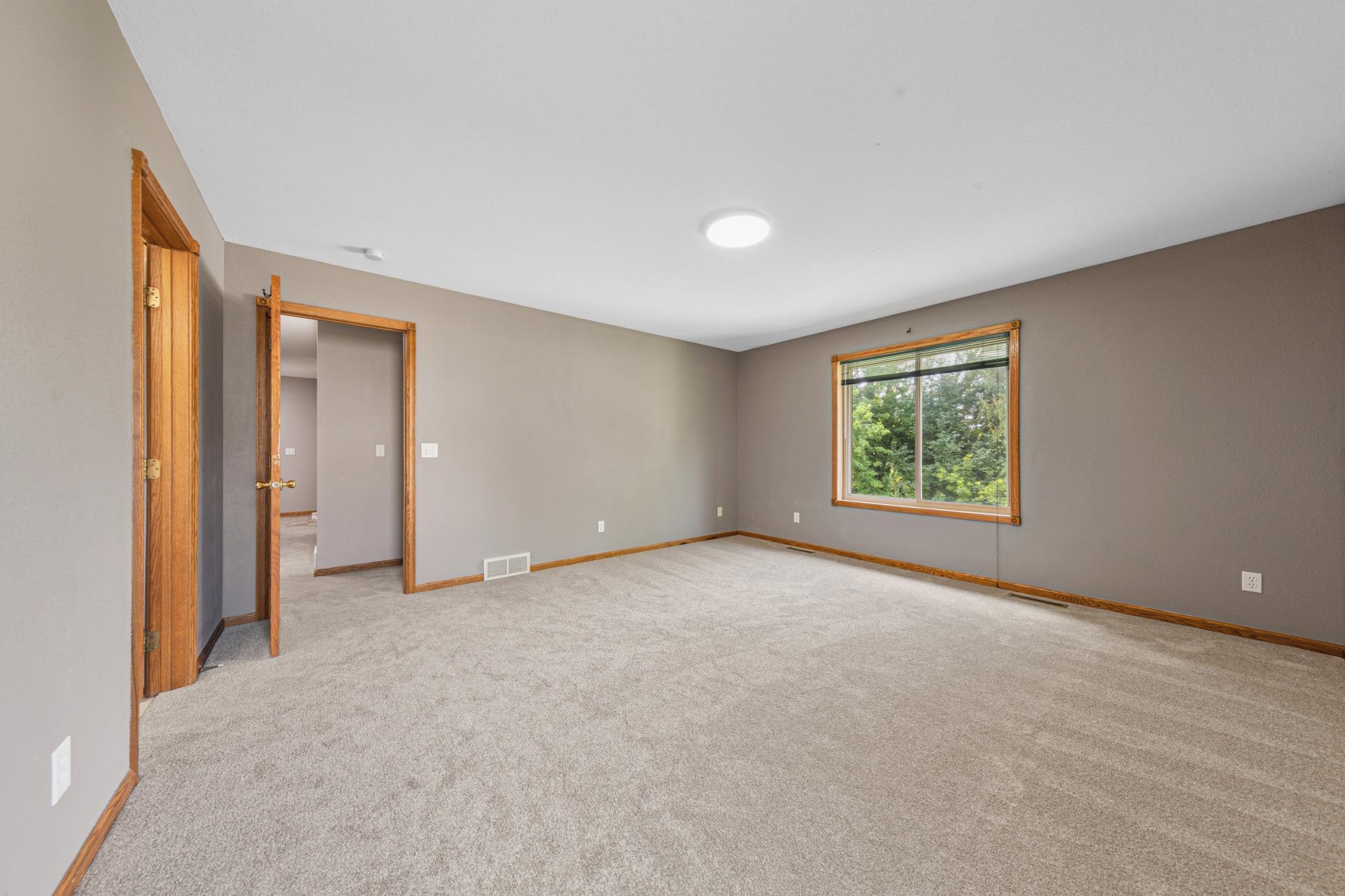 Primary bedroom, nice view of the backyard