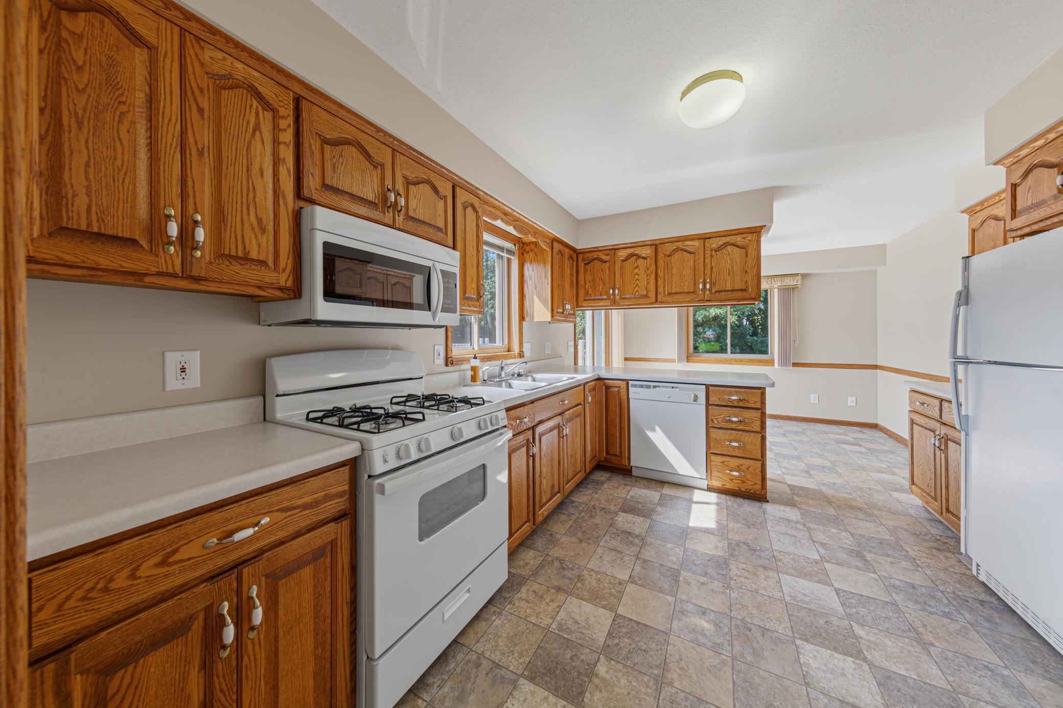 Kitchen has new stove and microwave