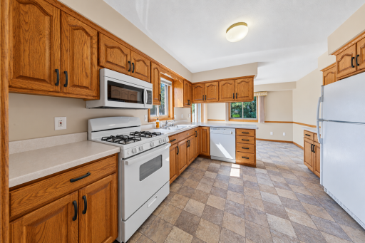 Kitchen has new stove and microwave. All new handles