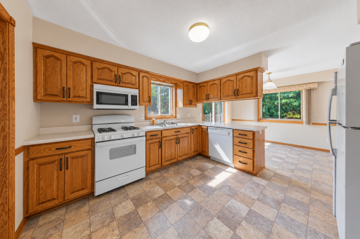 Solid, raised panel oak cabinetry and plenty of prep space