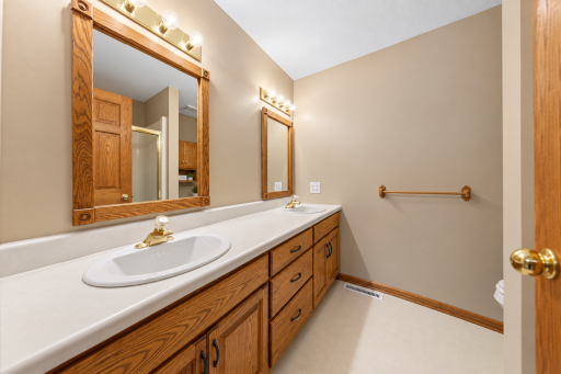 Private primary bath with double sinks and shower
