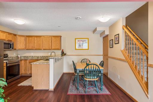 Cozy breakfast bar flanked by informal dining space