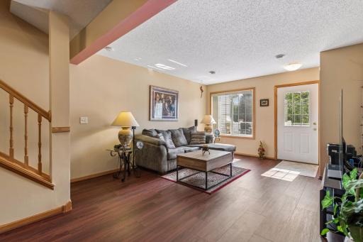 Check out this generous sized living space with new luxury vinyl plank flooring