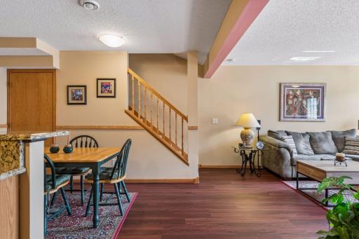 View from kitchen of the open staircase leading upstairs