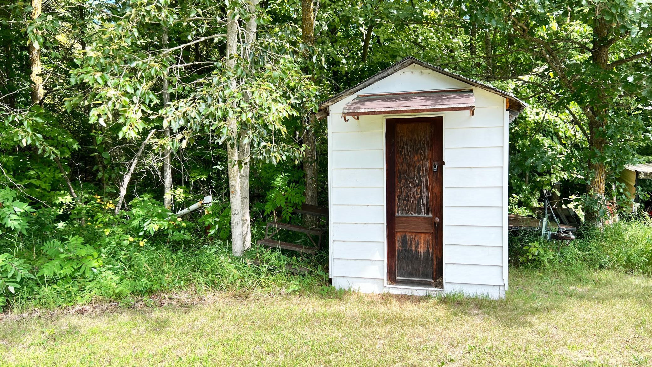 White storage shed.jpeg