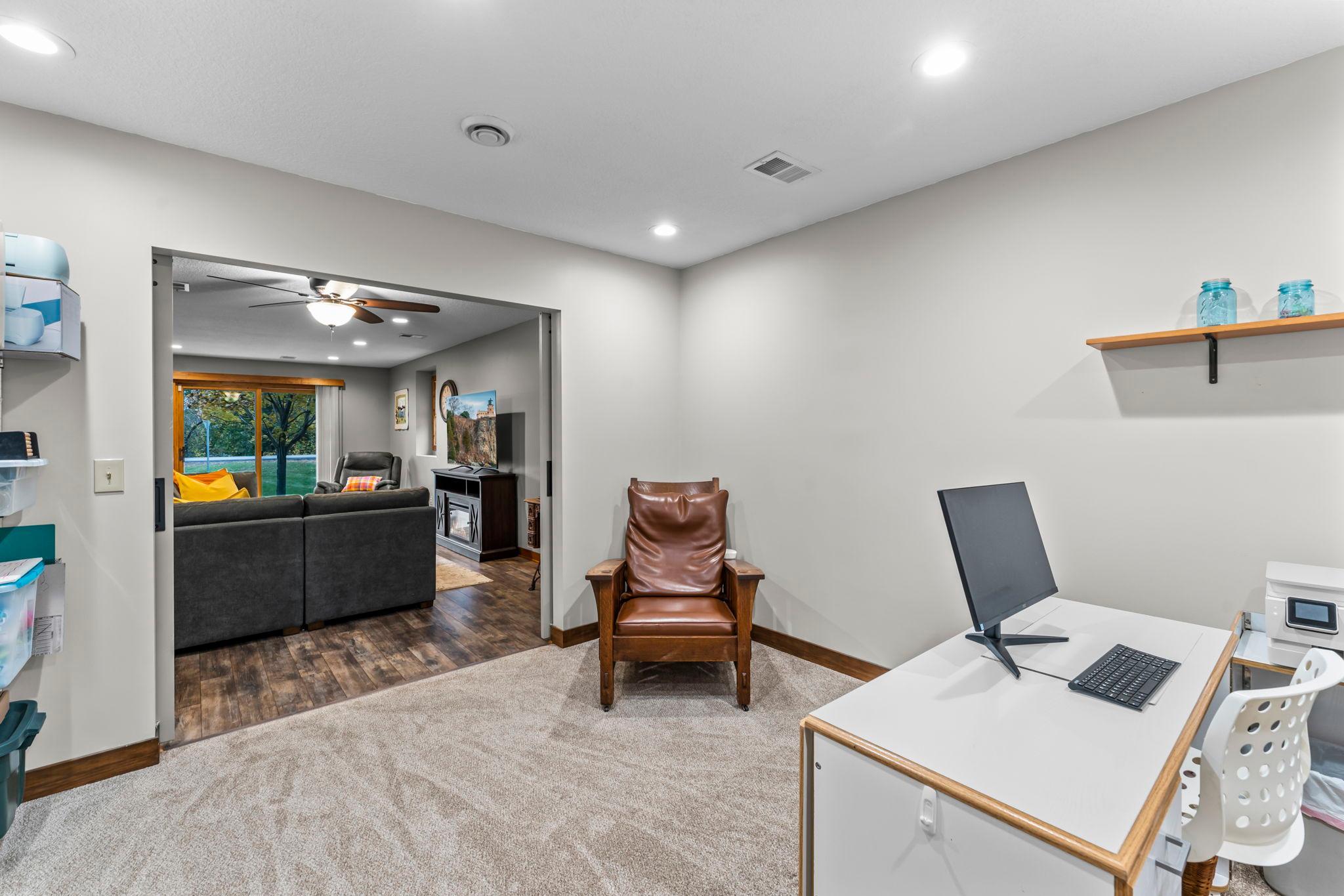 Ideal for working from home, hobbies, or additional storage. Additional lower-level laundry space with stackable washer and dryer along with a utility sink adds convenience.