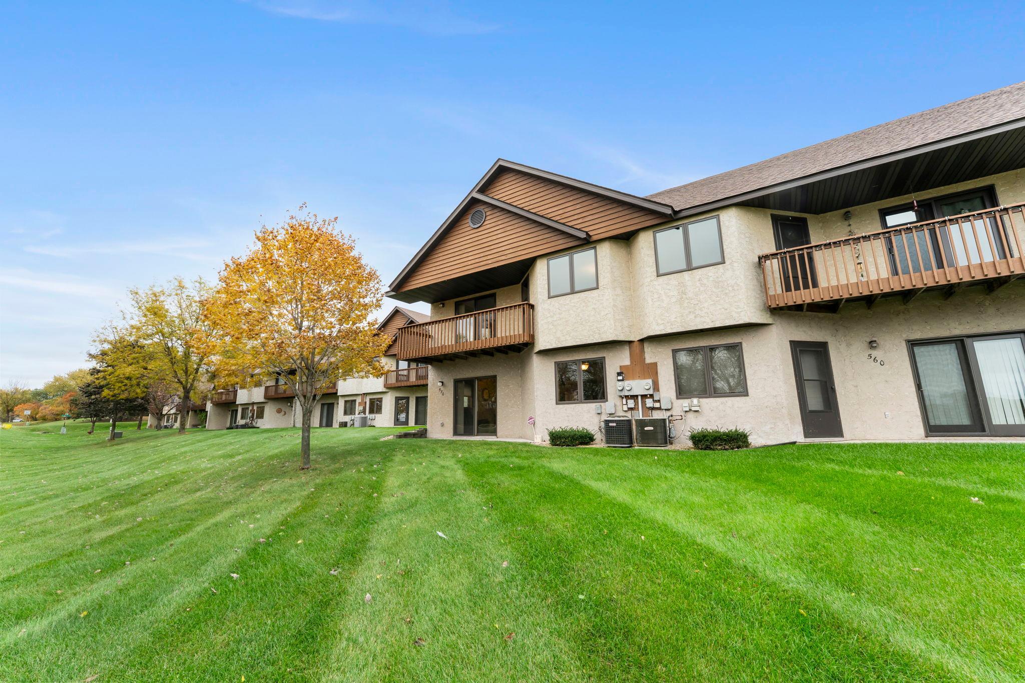 Additional highlights include stunning sunset views, seasonal sightings of swans in fall and winter, attached 2-car garage with hot and cold water spigots, HOA-maintained grounds, snow removal, and hazard insurance.