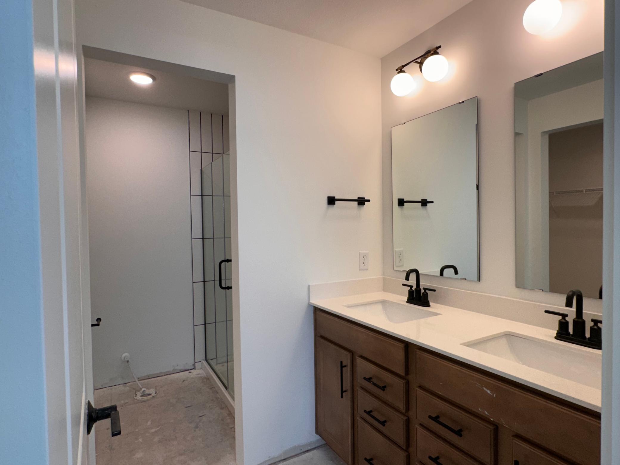 En Suite Bath- Tiled Shower/ Frameless Glass Door