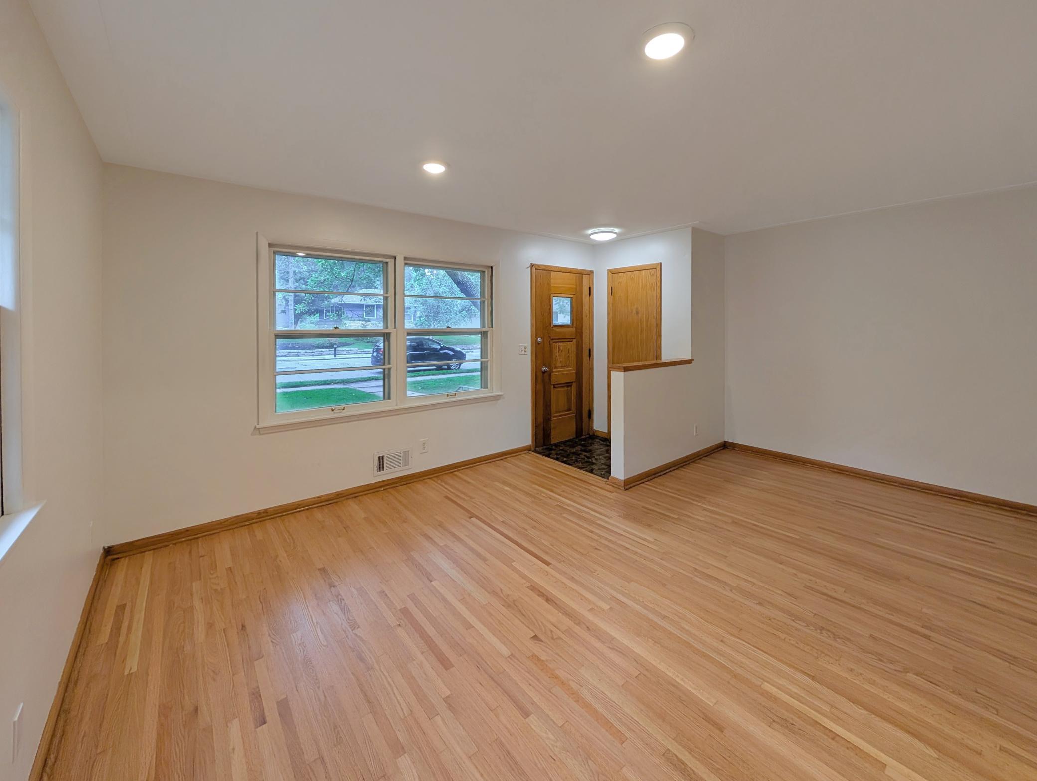 Spacious living room off a foyer with a coat closet!