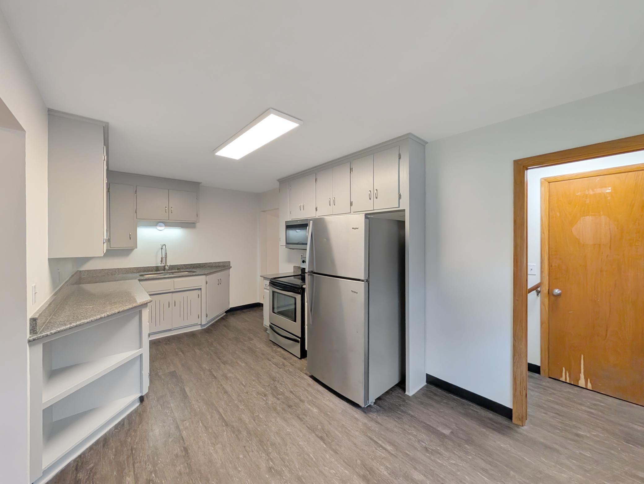 Updated kitchen with stainless steel appliances.