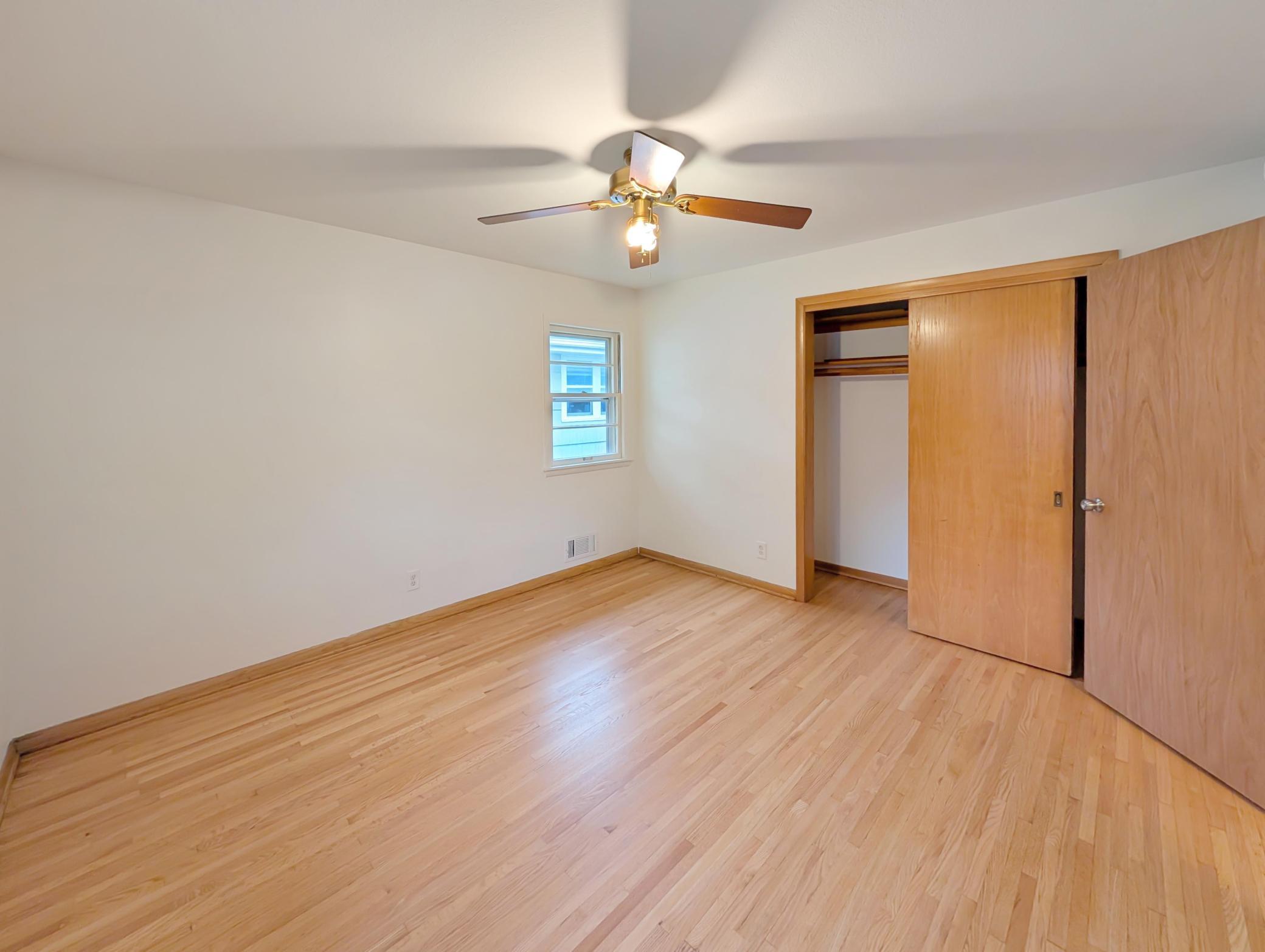 Primary bedroom on main level with ample closet space and ceiling fan!