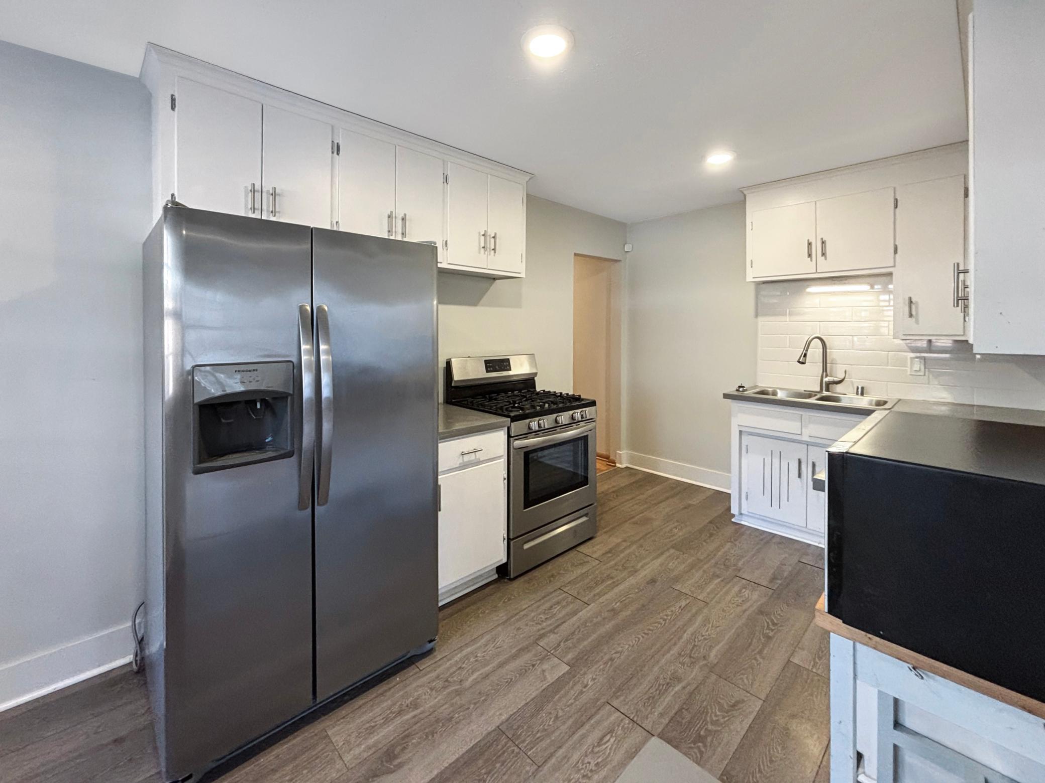 This kitchen not only has plenty of cabinet space, but also stainless steel appliances!