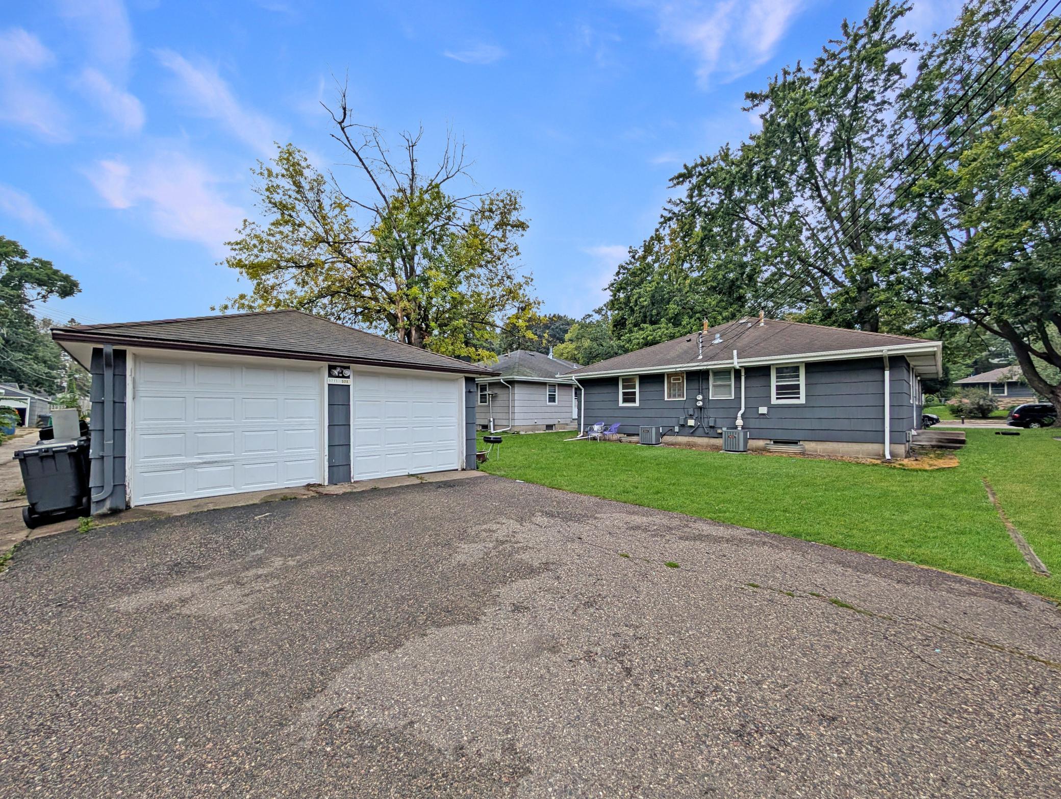 One garage space per unit with driveway space for additional parking off of alley.