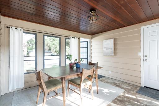 Porch - attaches garage and house - open to the fenced in backyard