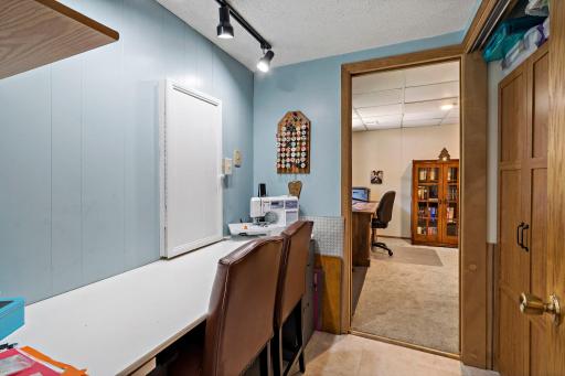 This versatile lower-level flex space connects the family room & bedroom, offering a great spot for a home office, hobby or craft area, or additional storage. Built-in workspace & cabinetry add everyday functionality.