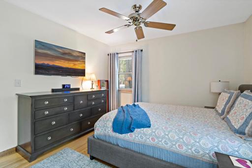 A second view highlights a second window in the primary bedroom, with plenty of room for a full bedroom set while maintaining an open, comfortable feel.