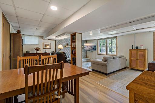 The lower level offers an open, flexible layout with space for both relaxing and dining or game nights. Multiple living zones make this a great area for entertaining, hobbies or everyday gatherings.