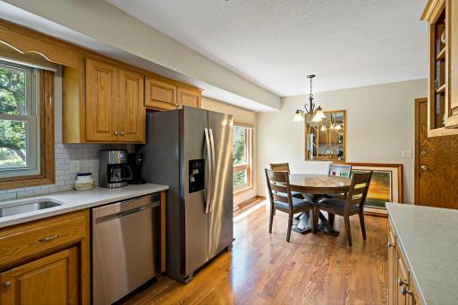 From this angle, the kitchen showcases its functional layout and connection to the dining area.
