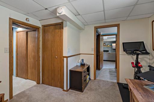 This view highlights the bedroom’s convenient access to the laundry area and adjoining flex space, with an easy connection back to the lower-level family room.