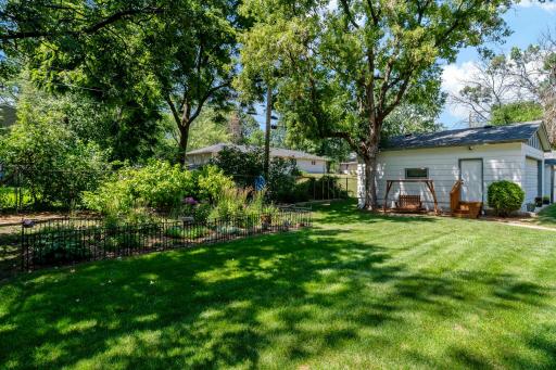 The spacious backyard is surrounded by mature trees & lush greenery, creating a peaceful setting with plenty of room to enjoy the outdoors. Established garden beds add charm, while the lawn offers space for play, pets, gardening, or entertaining.