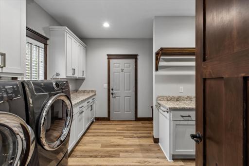 Garage access from mud / laundry room. An abundance of storage in here!