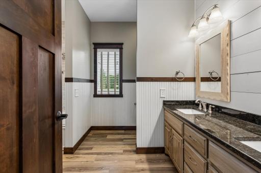 The wainscoting adds character in primary bathroom