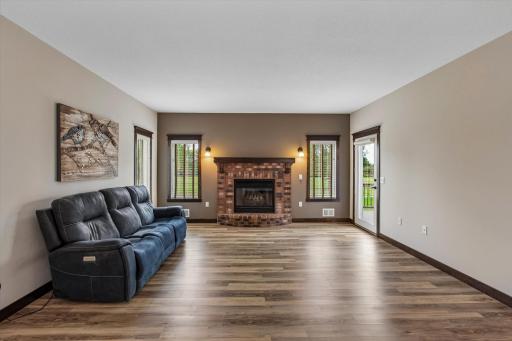 The brick gas fireplace makes a nice focal point for this room