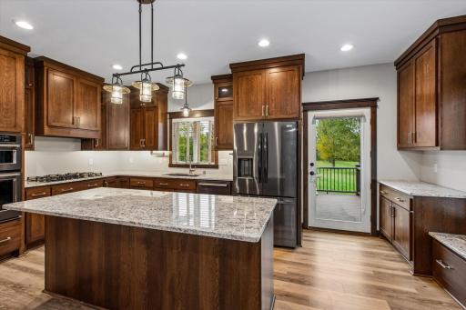 These custom quarter-sawn cabinets enhance the kitchen's design