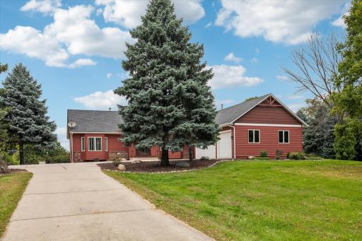 Photo for 6176 W 214th Street, Jordan, MN 55352 - listing #7128648 Welcoming exterior with classic red siding and crisp white trim