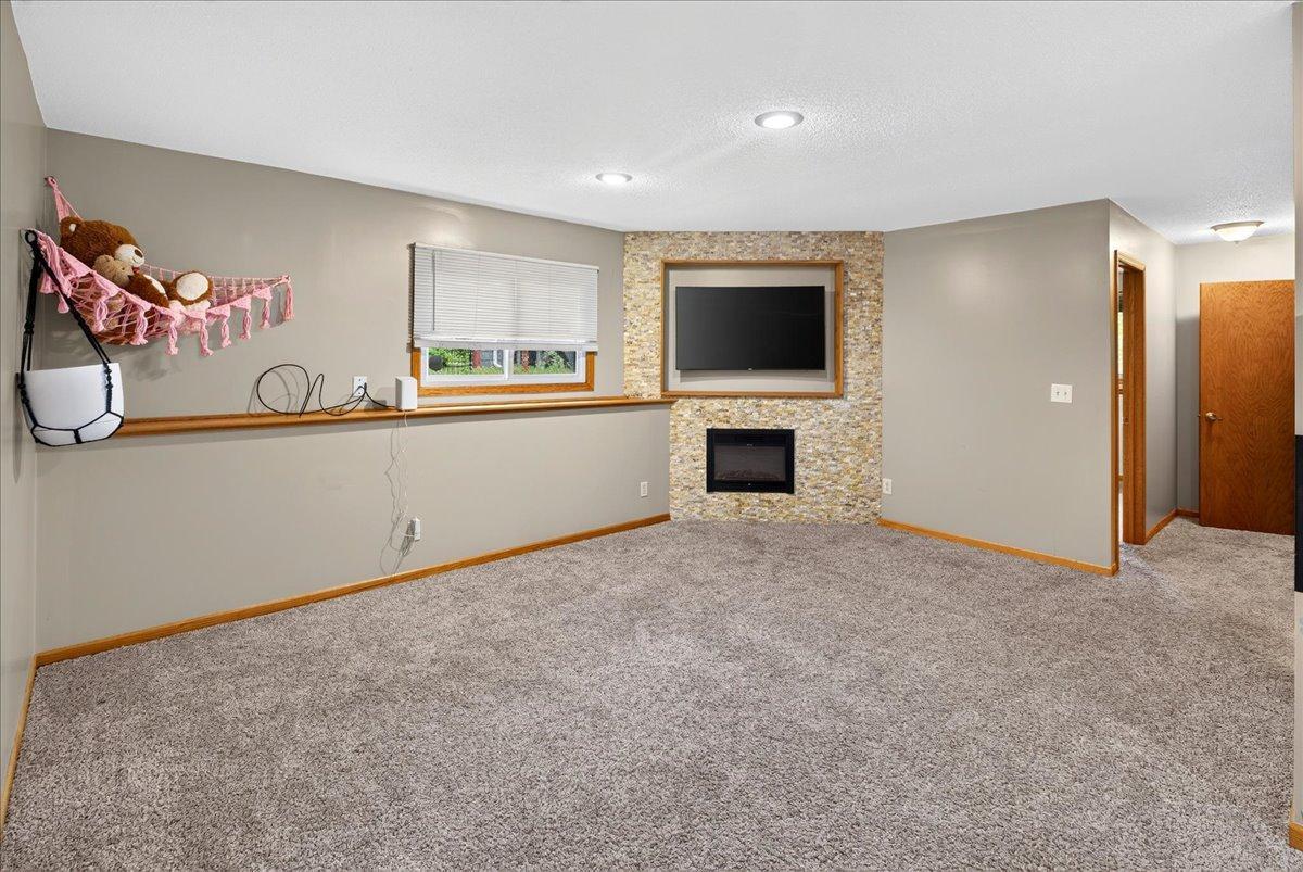 Fireplace with custom brick surround and tv niche
