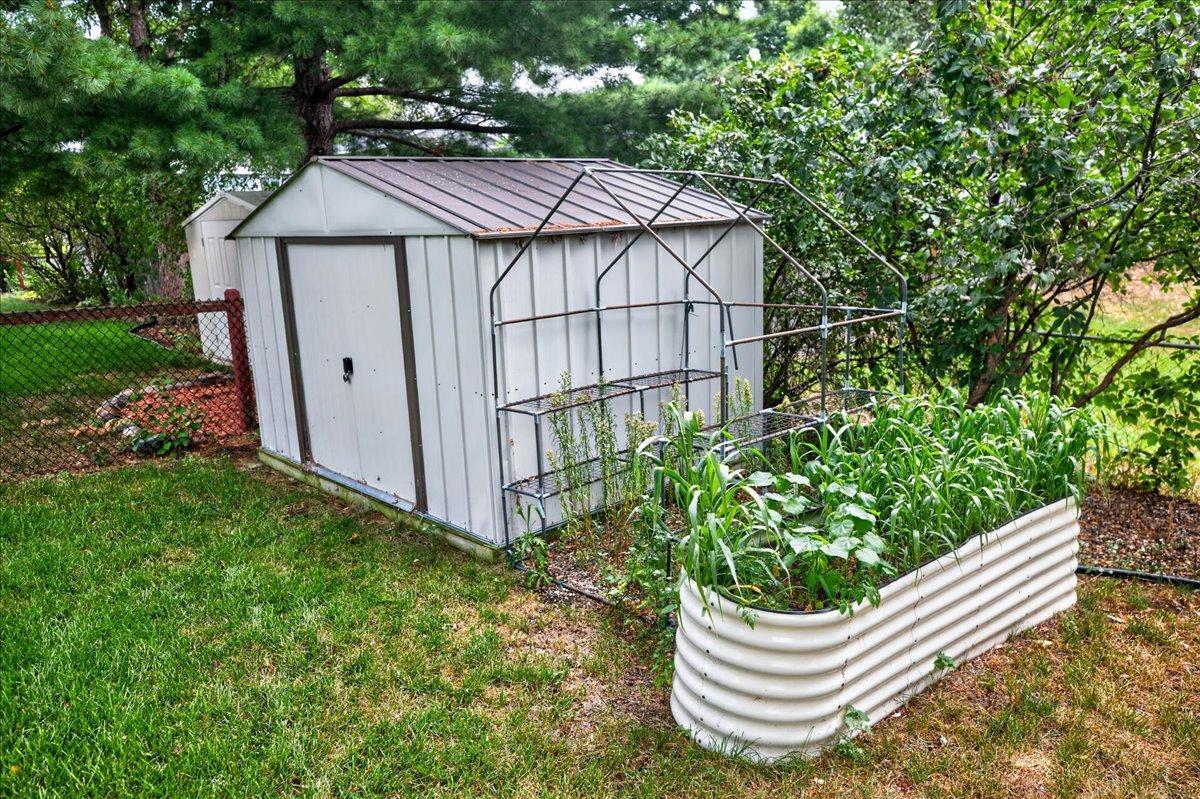 Garden shed; raised garden bed, Fenced backyard