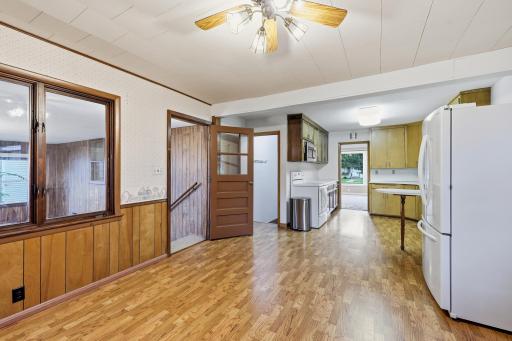standing in the dining area looking into the kitchen