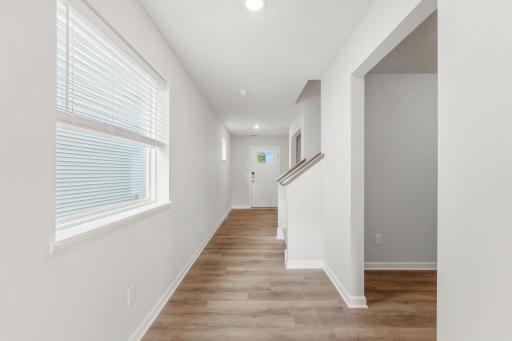 As you enter this beautiful home, so much natural light is welcoming you before you even enter the living area. *Model home photos, colors and selections may vary.*